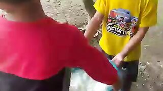 "Two brothers feeding livestock together 🐔❤️"