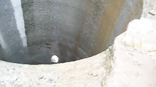 Dropping a big rock down a 450m deep hole.