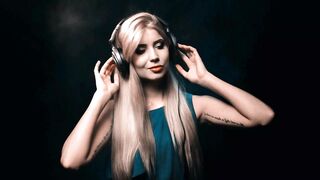 Happy Woman Listening to Music and Dancing in Headphones