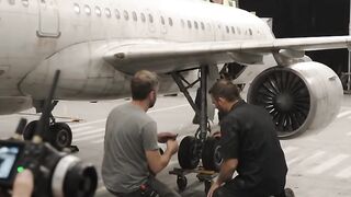 Technicians_inspect_scale_aircraf