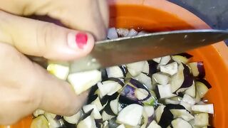 "Chopping fresh eggplant — preparing simple vegetable dish 🍆