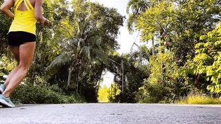 Woman Doing Leg Lunges in Tropical Park