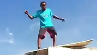 Surfer falling off the roof