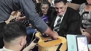 Traditional *viola* player with a Brazilian rhythm