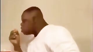 Black man falls off chair