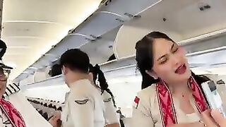 A beautiful moment as flight attendants pose together on board.mp4