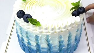 Beautiful Blue Buttercream Cake with Blueberry and Mint Decoration
