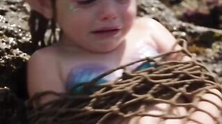 An old man saves the baby mermaid and returns her to the sea.