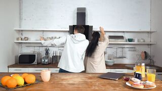 Happy couple dancing in a kitchen