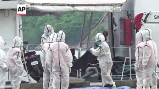 Philippines coast guard brings bodies to shore after ferry fire killed at least 35