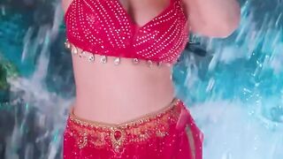 Sunny Leone looking so sexy in red dress super sexy actress showing her boobs and nipples watch now.