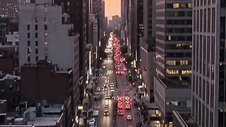 Pedestrians Crossing Modern City Street At Sunset