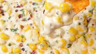 Looking for the ultimate cheesy snack for your next movie night? Try this creamy garlic corn dip that pairs perfectly with crunchy nachos!