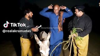 Police man And Bald man with his Donkey