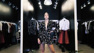 Woman modeling a short black dress