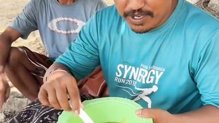 Eating fresh mango *rujak* under a tree.