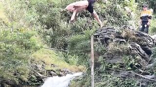 A spectacular leap into a waterfall. Ha Giang Loop