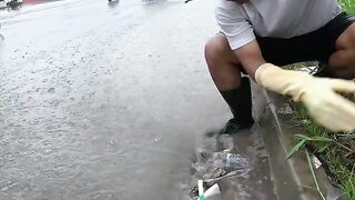 Clearing Trash From the Culvert to Keep the Street Safe