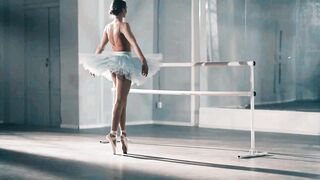 Graceful Ballerina Practicing Ballet in Ballroom Studio
