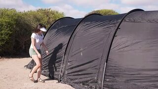 A prety woman camping solo by the beach