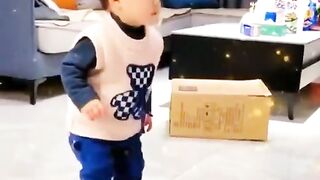 Baby want to sit on little chair