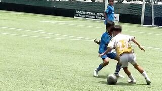 young child showing incredible skills while playing ball.”