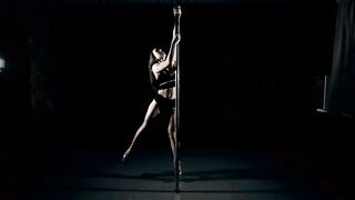 Slim Woman Performing Elegant and Powerful Pole Dancing Routine