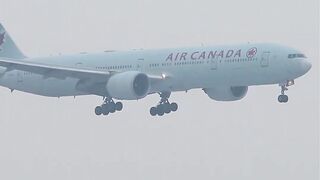 Air Canada Boeing 777-300ER landing at a SNOWY Munich Airport