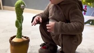 funny child with funny plant