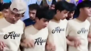 Group of Young Indonesian Men Performing Traditional Saman Dance Together at Wedding Party