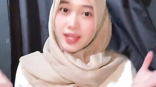 A beautiful woman in a hijab joins in on a viral TikTok dance.