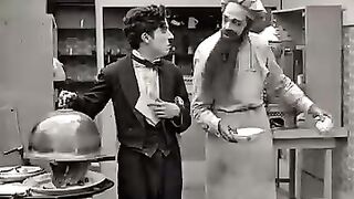 Very funny, Charlie Chaplin served acat to guest.