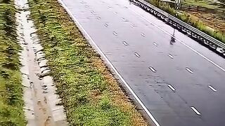 Car out of control on road during rain