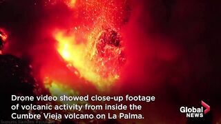 La Palma volcano_ Drone shows inside of flaming crater as eruptions continue.