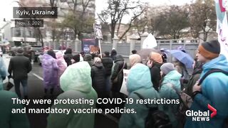 They turn us into mutants__ Anti-vaccine protesters block traffic in Kyiv, Ukraine