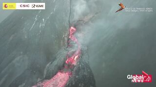 La Palma volcano_ Drone video shows torrents of molten rocks flowing in lava streams