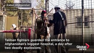 Taliban guard Afghanistan hospital a day after deadly explosions.