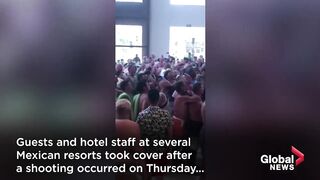 Tourists in Mexico take shelter after 2 killed in shooting involving alleged drug gangs.