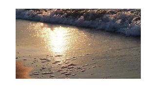 "Serene Sunset: The Interplay of Waves, Water, Sea, and Land in Nature"