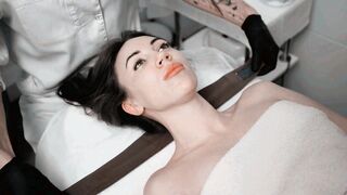 Beautician Putting Hairband on Woman in Spa Salon