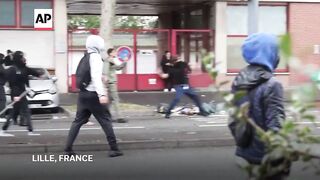 Students in France set trash bins ablaze during protest over school funding