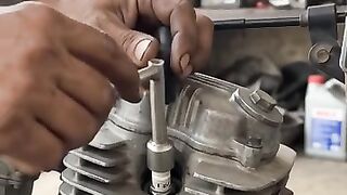 Plug cleaning in honda bike