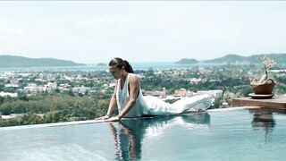 Healthy Woman Doing Warrior Yoga Pose at Tropical Resort