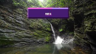 Hidden Waterfall Between Dramatic Rocky Cliffs in a Lush Green Forest