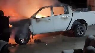 Israeli occupation forces set fire to a vehicle and sprayed provocative slogans during an attack on a house in southern Hebron