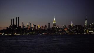 Captivating view of New York City's skyline at night, showcasing iconic skyscrapers.