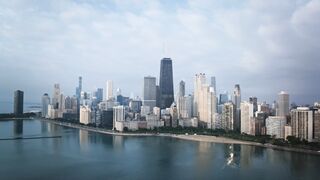 Aerial view of Chicago's iconic skyline and Lake Michigan.