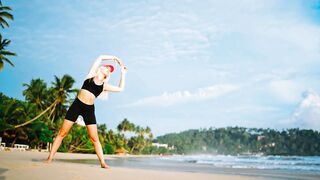 Sporty Girl Performing Beach Stretching and Fitness Exercises