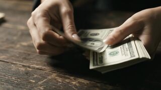 Hands Counting Dollar Bills Finance Success Concept
