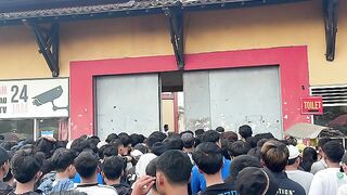 waiting to enter football stadium